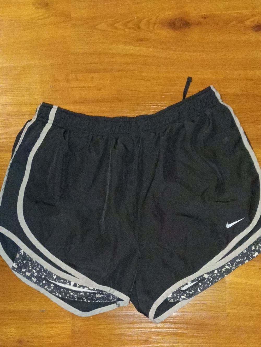 Nike Women's Black Running Shorts with White Trim and Speckled Overlay Size Larg
